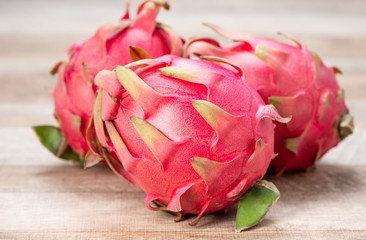 Fresh red dragon (pitaya) fruit juice in glass mug. Close up 