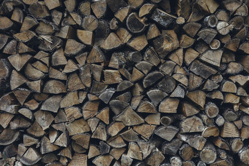 Dried chopped stacked firewood logs