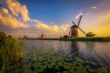 Sunset above old dutch windmills in Kinderdijk, Netherlands