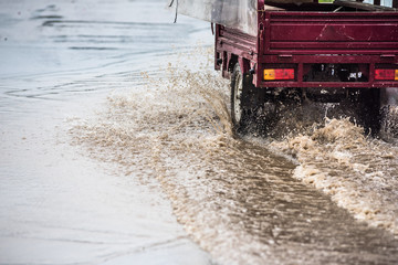 dirty water splash after vehicle roaring by