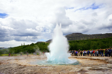 Strokkur Geysir Eruption with blurry people, Iceland