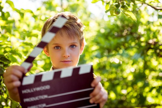 Film is shot, Filming of children's film, Cartoons for children. Take pictures of children's portraits. Casting children for a role in the cinema. Boy with a cracker

