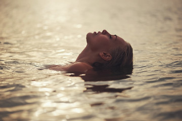 beautiful blonde girl in water - Powered by Adobe