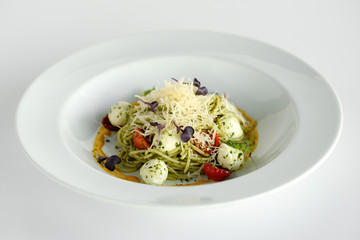 Spaghetti with basil and mozzarella cheese