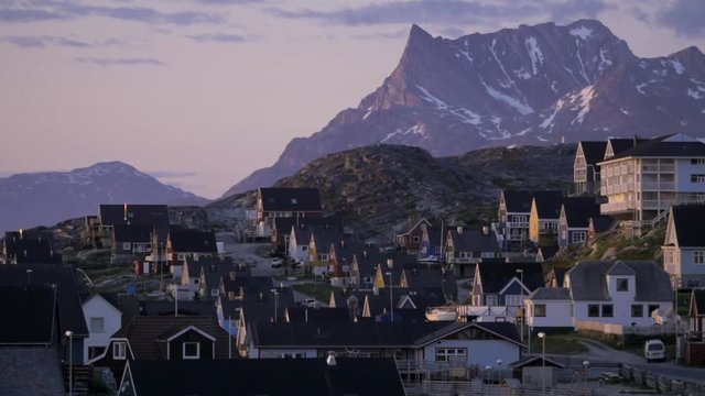 Epic Mountain and Colourful Village in Greenland at Sunset in Slow Motion