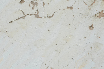 Wall fragment with scratches and cracks