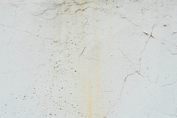 Wall fragment with scratches and cracks