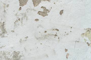 Wall fragment with scratches and cracks