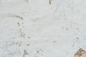Wall fragment with scratches and cracks