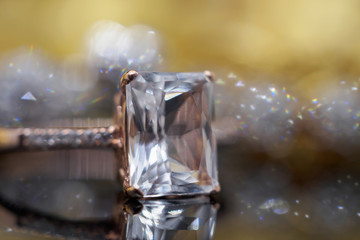 Luxury Jewelry diamond and pink topaz ring with reflection on black background