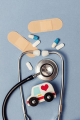 Healthcare background with stethoscope and ambulance