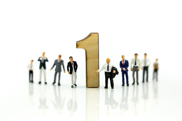 Miniature people : Businessman and team with wooden number of 1,2,3 , to be the first,business competition concept.