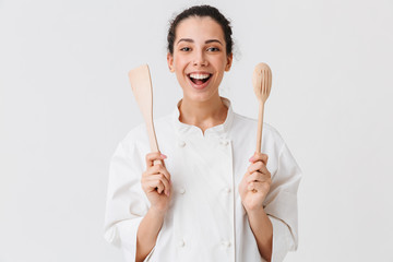 Portrait of a cheerful young woman cook - obrazy, fototapety, plakaty