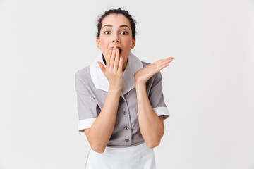 Portrait of a shocked young housemaid