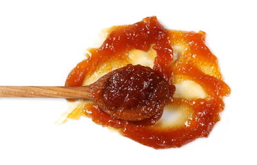 Peach jam, marmalade with wooden spoon isolated on white background and texture