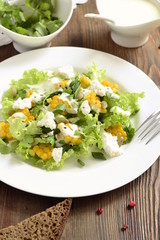 Salad with corn, greens, feta with mayonnaise sauce