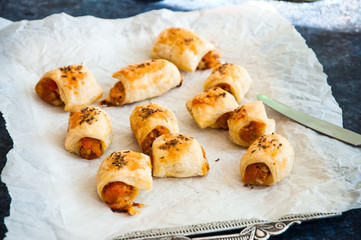 Puff pastry rolls with pumpkin and cheese filling. Close up.