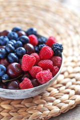 Various beautiful summer berries covered by water drops.