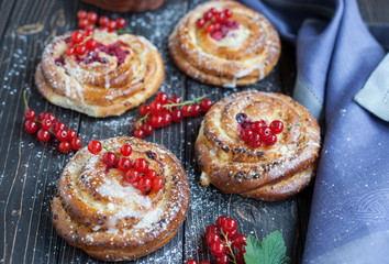 Fresh yeast buns with cheese and berries.