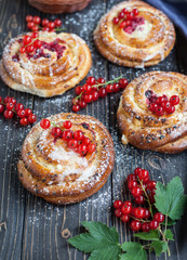 Fresh yeast buns with cheese and berries.