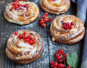 Fresh yeast buns with cheese and berries.