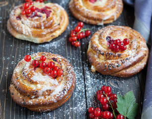 Fresh yeast buns with cheese and berries.