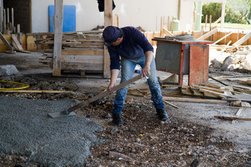 bricklayer at work in a building site