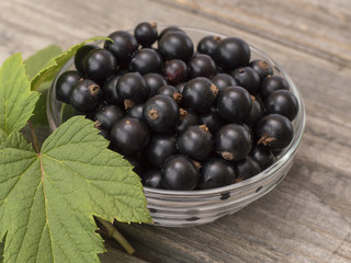 black currant on a wooden table. 