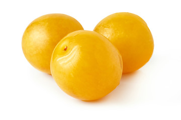 Yellow cherry plums also known as mirabelle plums isolated on white background
