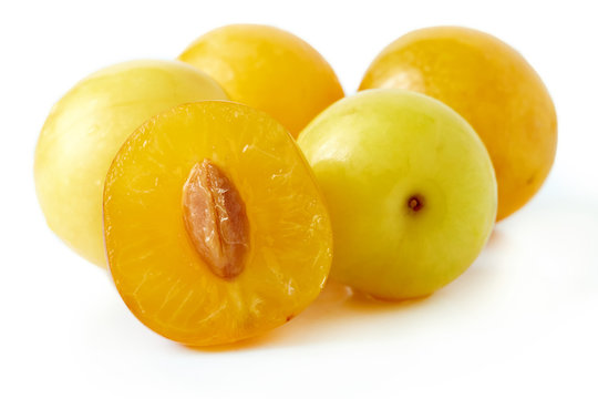 Yellow cherry plums also known as mirabelle plums isolated on white background