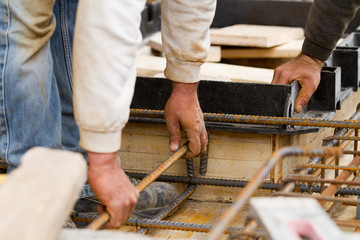 bricklayer at work in a building site