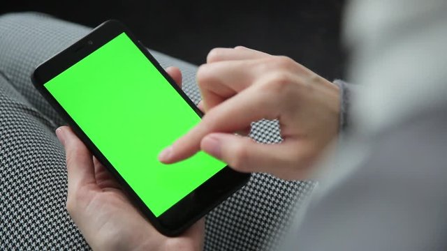 Business woman using a Smart phone Touchscreen CHROMA KEY- Close-up.