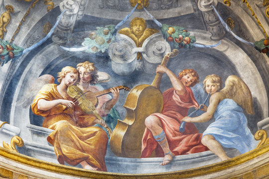 PARMA, ITALY - APRIL 15, 2018: The symbolic fresco of angels with the music instruments in church  Chiesa di Santa Cristina by Filippo Maria Galletti (1636-1714).