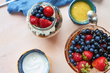 vase with fresh berries, product set for breakfast