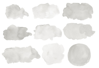 A set of abstract watercolor stains in shades of gray. Hand drawn, painted splashes, blobs,...