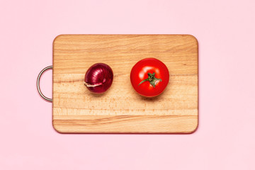 Healthy Eating. One Fresh Red Tomato Near Violet Bow On A Wooden Chopping Board