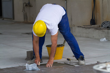 bricklayer at work in building site