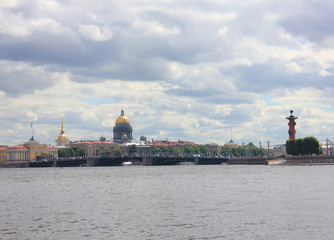 St. Petersburg Scenic Skyline with Neva River Water, Saint Isaac's Cathedral Dome, Rostral Columns and Palace Bridge in Russia. Summer Cityscape of Famous Russian City on Cloudy Day before Rain.