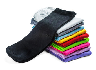 socks of different color are isolated on white. The stack of socks