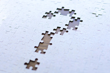 Question mark from the missing parts of the puzzle. Set goals, tasks and ways of their solution and implementation. Business concept. 