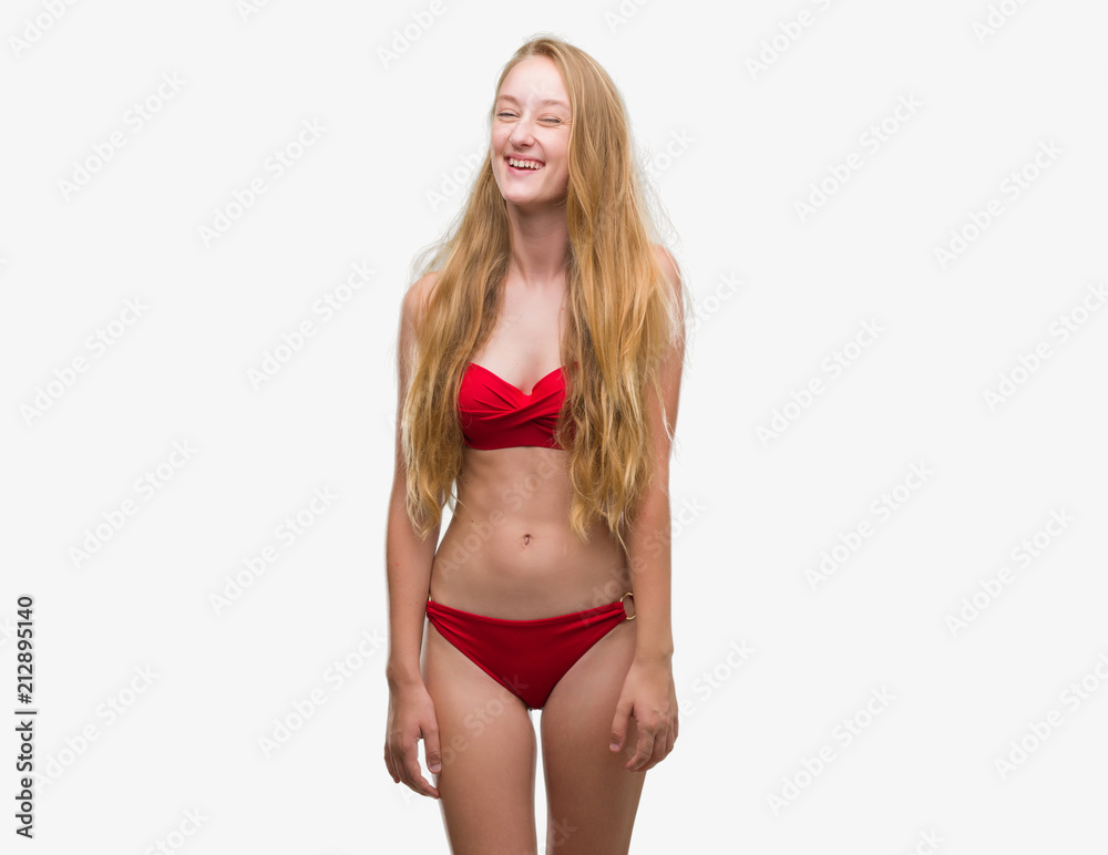 Sticker blonde teenager woman wearing red bikini winking looking at the camera with sexy expression, cheerfu