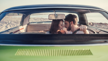 Obraz na płótnie Canvas Couple with retro car