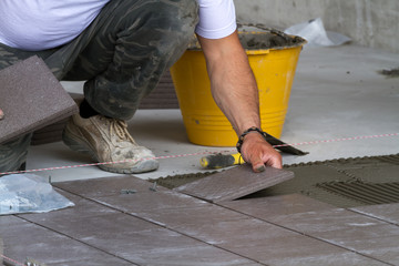 bricklayer at work in building site