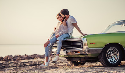 Fototapeta premium Couple with retro car