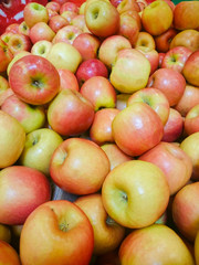 Red apples on the counter in the supermarket.