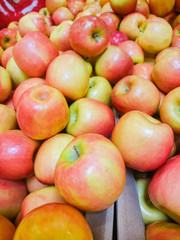 Red apples on the counter in the supermarket.