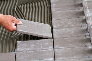 bricklayer at work in building site