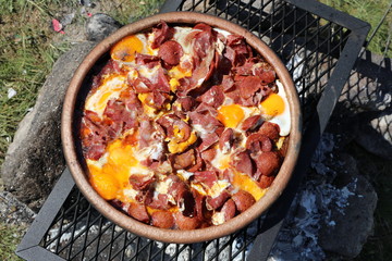 Fried egg with sausage and bacon