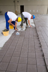 bricklayer at work in building site