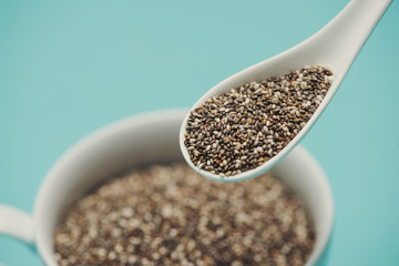 Close-up of ealthy chia seeds in a spoon. Text space.